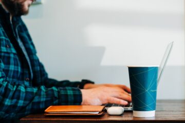 Freelancer working with coffee, freelancer skills to develop in 2024
